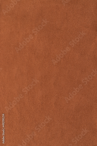 Brown denim fabric. Texture background. Close up.