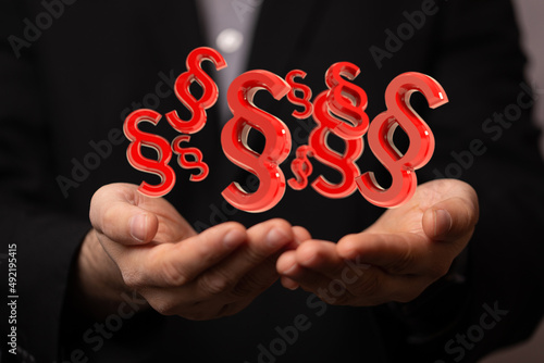 Hand mit Paragraf