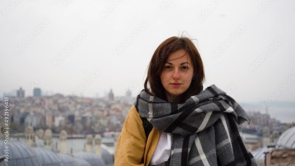 Portrait of a young woman on the background of a panorama of the city Portrait of a young woman on the background of a panorama of the city