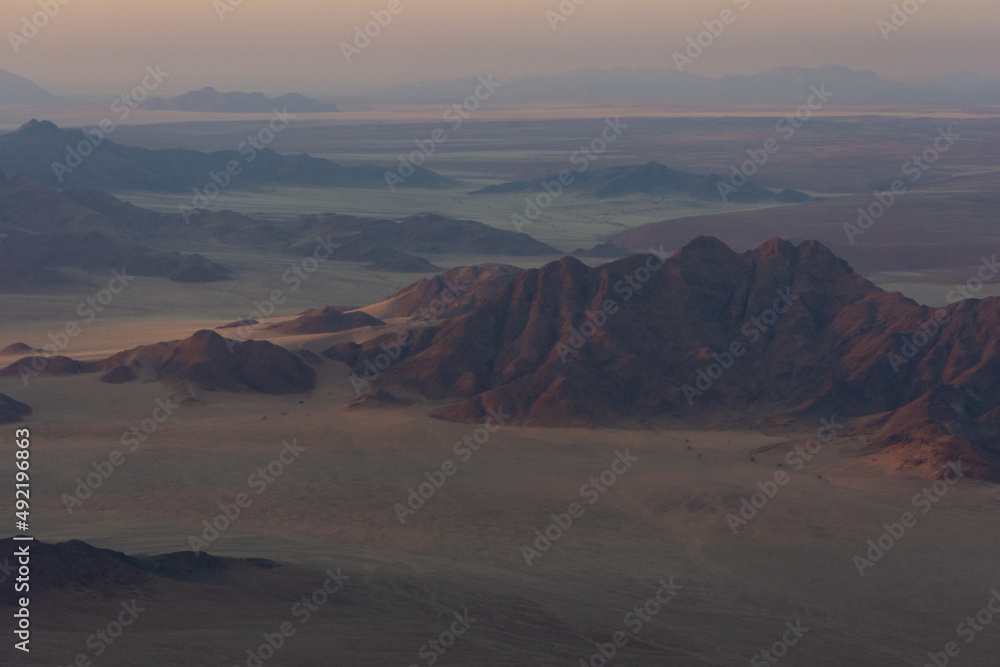 Namibian mountains seen at sunrise from aerial view
