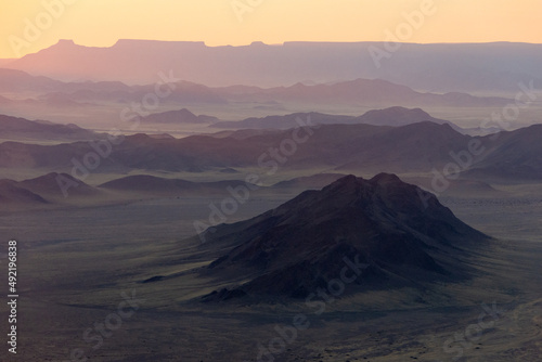 Namibian mountain landscape seen at sunrise from aerial view