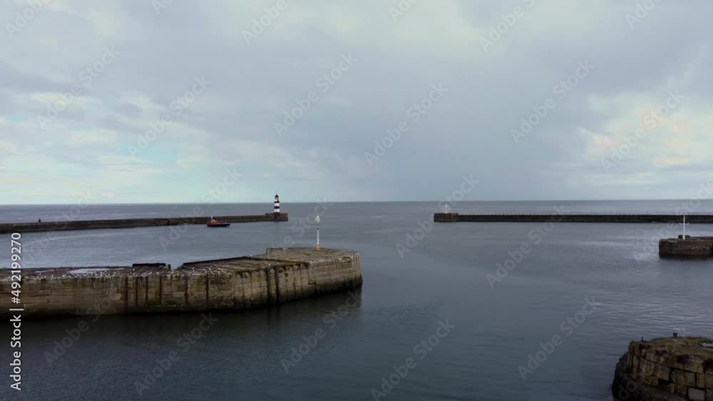 Aerial drone shot accelerating over Seaham Harbour and lighthouse Aerial drone shot accelerating over Seaham Harbour and lighthouse