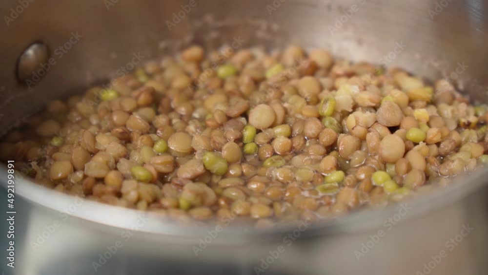 Cooking brown lentils close-up, selective focus. Mazur, A Vegetarian Healthy Diet Of Organic Products Cooking brown lentils close-up, selective focus. Mazur, A Vegetarian Healthy Diet Of Organic Products