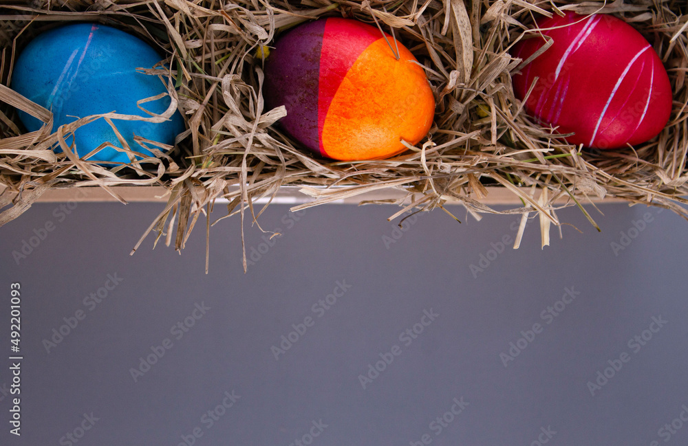 Easter eggs. Festive decoration. Easter. Celebration. Bright holiday. Eggs on a gray background. Multi-colored eggs on a gray background. Easter eggs. Festive decoration. Easter. Celebration. Bright holiday. Eggs on a gray background. Multi-colored eggs on a gray background.