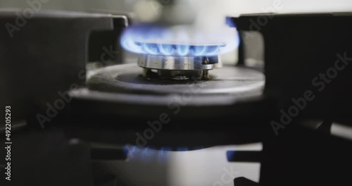 Close-up of spontaneous combustion of a gas burner flame photo