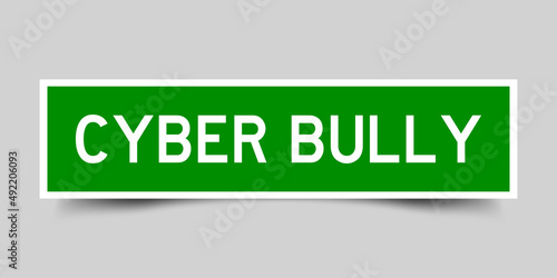 Square label sticker with word cyber bully in green color on gray background