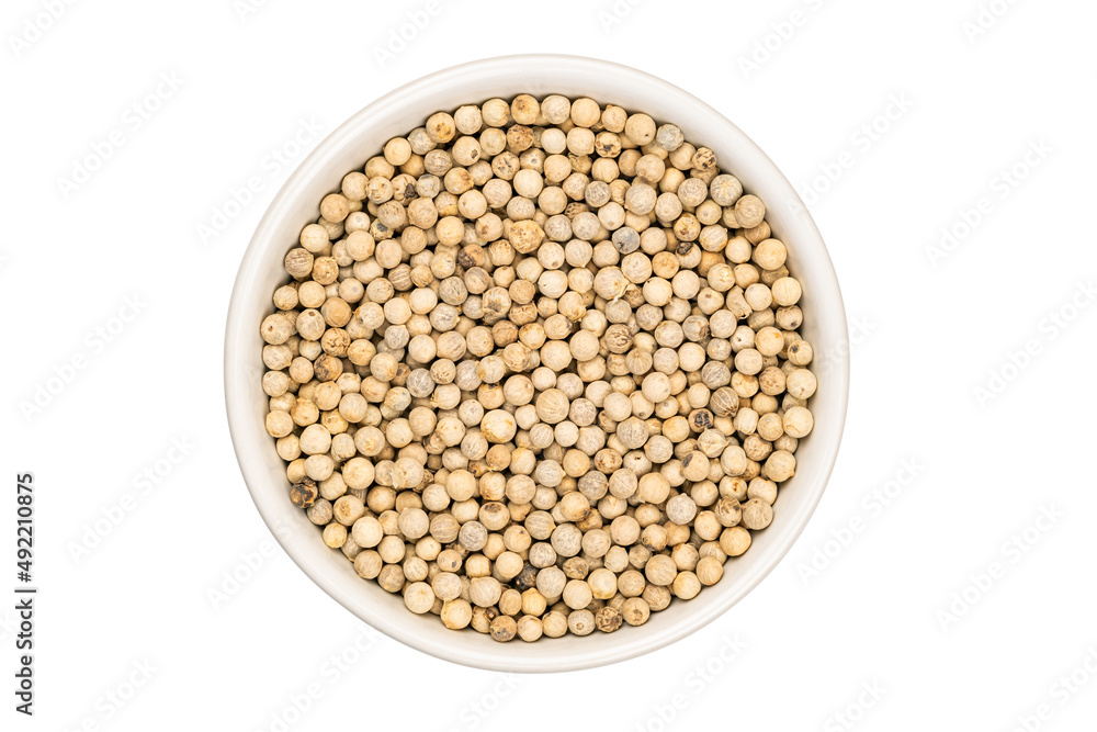 Top view of white peper in ceramic cup on white background. Top view of white peper in ceramic cup on white background.