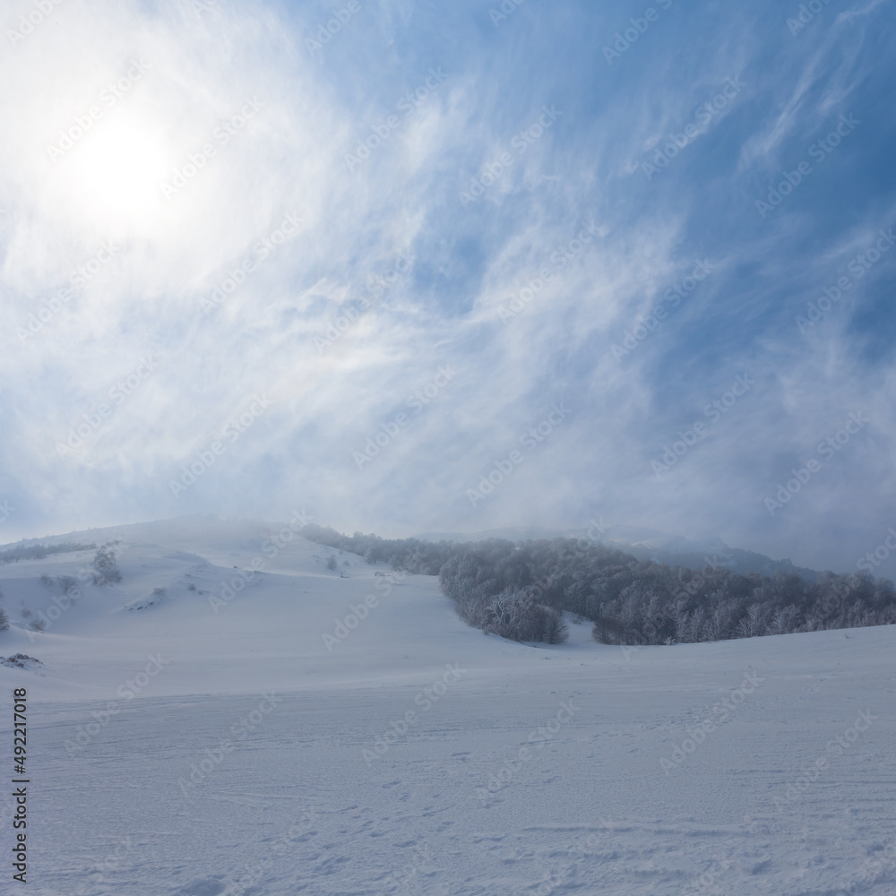mountain plateau in snow at sunny day, winter outdoor landscape