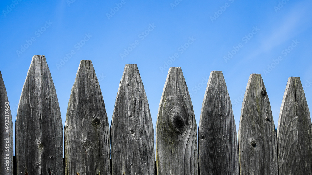 Wooden fence with nice blue sky Wooden fence with nice blue sky