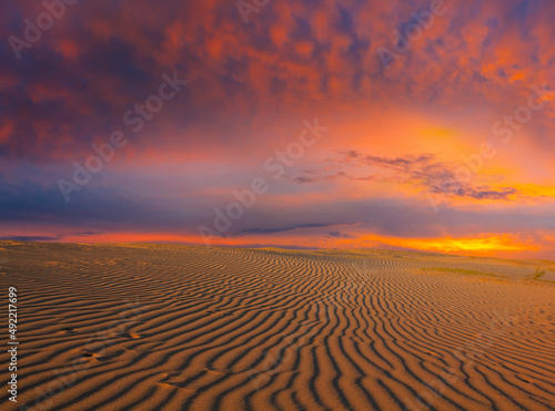 sandy desert at the dramatic sunset