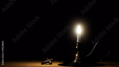 3D Lighting white candle on brass candle holder and cross metal put on brown wood table on dark night background with copy space