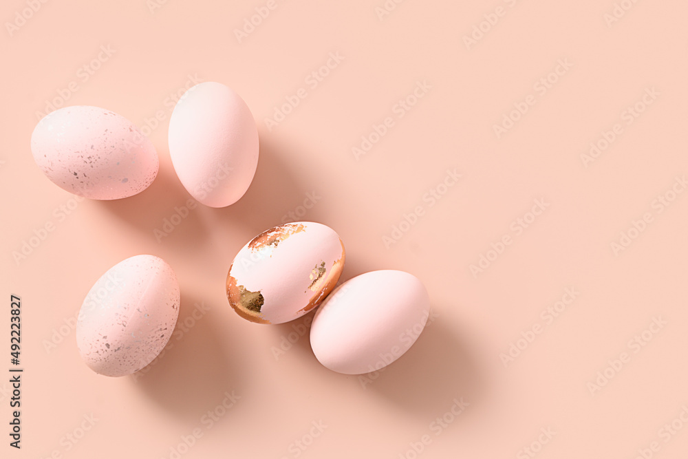 Pink pastel eggs on pink monochrome background. Flat lay. Happy Easter minimalist greeting card with copy space. Top view. Concept eggs dyeing.