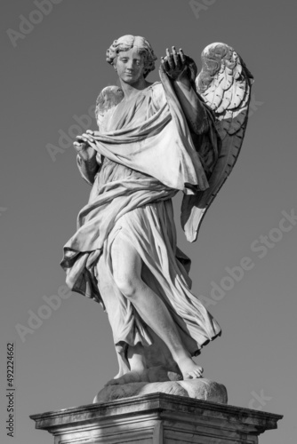 ROME, ITALY - SEPTEMBER 1, 2021: The statue of Angel with the Sudarium on the Ponte Sant'Angelo by Cosimo Fancelli (1620  - 1688). photo