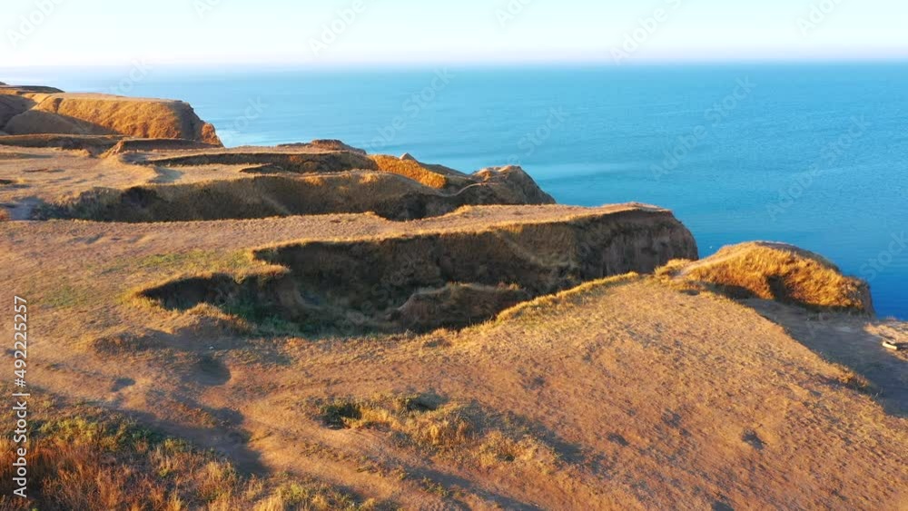 Spectacular relief shapes of the sandy hills from a bird's eye view. Location place canyon Stanislav, Dnieper Bay, Ukraine, Europe. Cinematic drone shot. Filmed in UHD 4k video. Beauty of earth. Spectacular relief shapes of the sandy hills from a bird's eye view. Location place canyon Stanislav, Dnieper Bay, Ukraine, Europe. Cinematic drone shot. Filmed in UHD 4k video. Beauty of earth.