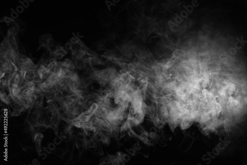 Smoke over black background. Fog or steam texture.