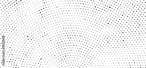 The halftone texture is black and white. Monochrome abstract, chaotic texture. Waves of dots on a white background, abstract halftone