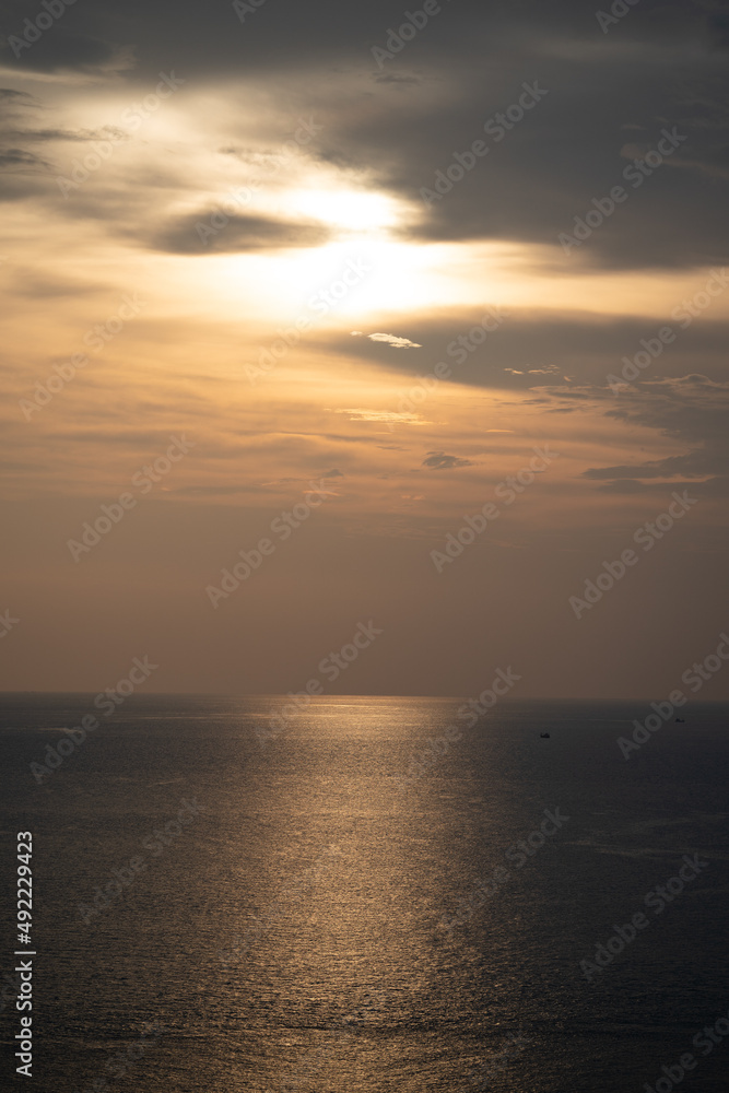 Twilight Golden time in the sea view of Phrom Thep Cape, the tropical sea sunset period, scenic point of Phuket Island, The Pearl of the Andaman Sea,Thailand popular for tourist in the world.