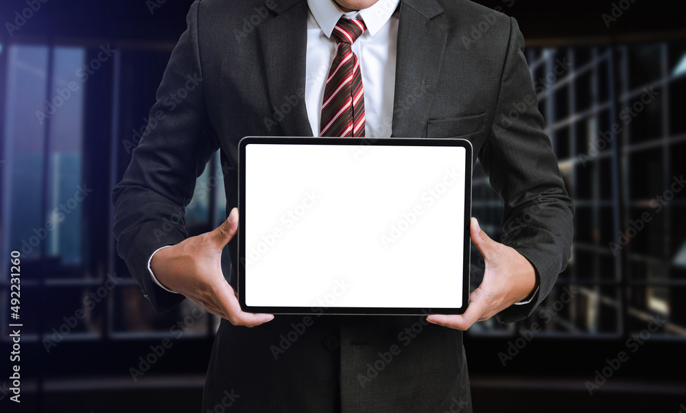 Business man holding and shows touch screen tablet with digital device, technology Business man holding and shows touch screen tablet with digital device, technology
