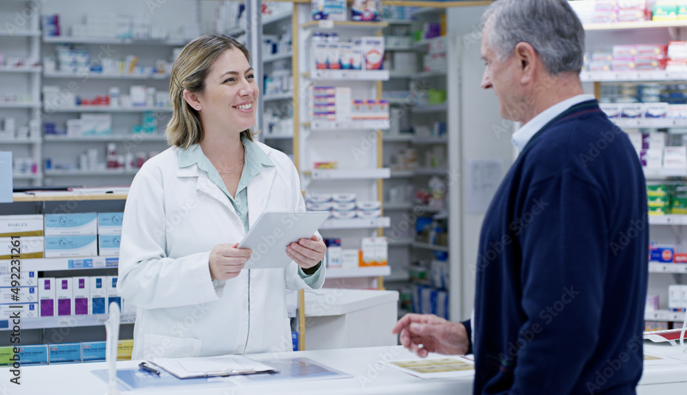 Always ready to deliver the best solutions to you. Shot of a young pharmacist handing out a prescription to a senior citizen at a pharmacy. Always ready to deliver the best solutions to you. Shot of a young pharmacist handing out a prescription to a senior citizen at a pharmacy.