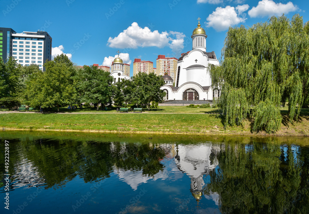 Transfiguration Orthodox Church and reflection in the water. Kyiv, Ukraine Transfiguration Orthodox Church and reflection in the water. Kyiv, Ukraine