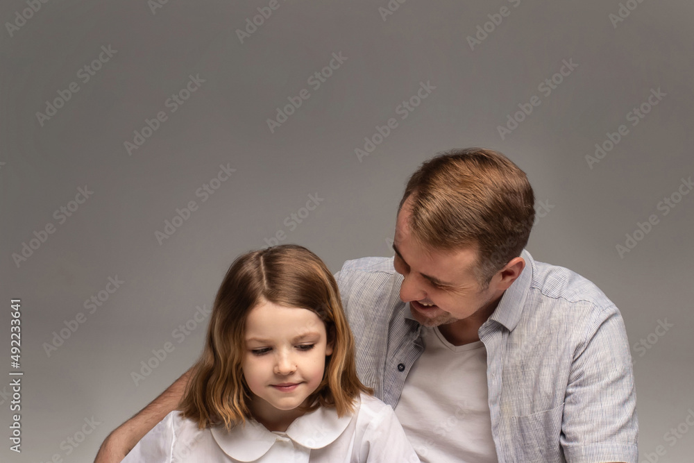 portrait of happy father and cheerful son, cute boy playing with dad in the house, child hugging father, dad playing with children, dad hugs daughter portrait of happy father and cheerful son, cute boy playing with dad in the house, child hugging father, dad playing with children, dad hugs daughter