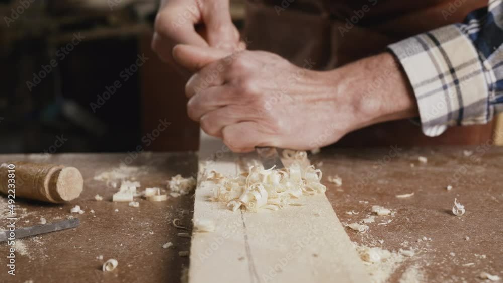 Close up of a Carpenter carving wood with chisel . High quality 4k footage Close up of a Carpenter carving wood with chisel . High quality 4k footage