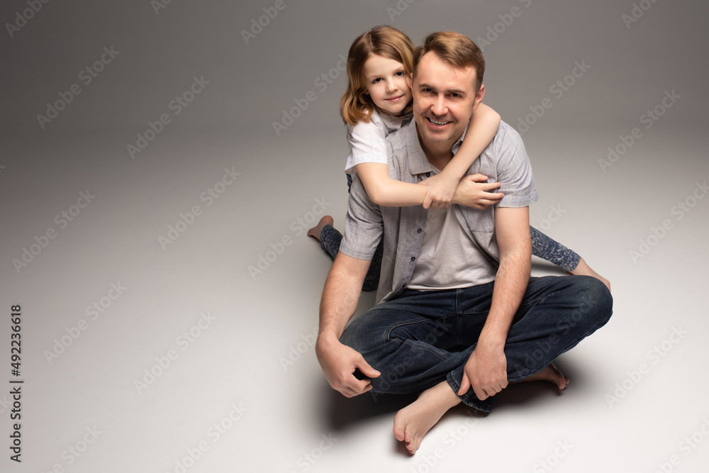 portrait of happy father and cheerful son, cute boy playing with dad in the house, child hugging father, dad playing with children, dad hugs daughter portrait of happy father and cheerful son, cute boy playing with dad in the house, child hugging father, dad playing with children, dad hugs daughter