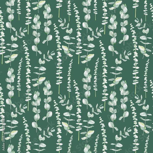 Watercolor seamless pattern with eucalyptus branches on green background 