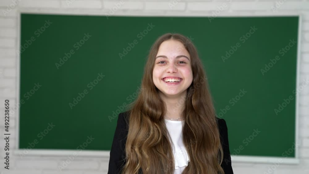 happy school girl laughing with healthy teeth smile on blackboard background, happiness happy school girl laughing with healthy teeth smile on blackboard background, happiness