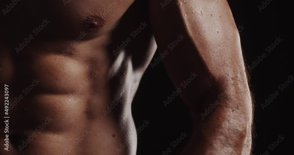 Lifting weights while twisting his body Lifting weights while twisting his body