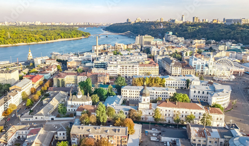 Kyiv cityscape aerial drone view, Dnipro river, downtown and Podol historical district skyline from above, city of Kiev and Dnieper, Ukraine photo