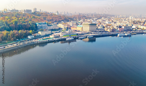 Kyiv cityscape aerial drone view, Dnipro river, downtown and Podol historical district skyline from above, city of Kiev and Dnieper, Ukraine