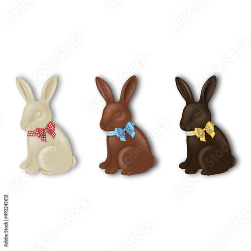Set of chocolate Easter rabbits with colorful bows. Dark, milk and white chocolate bunnies
