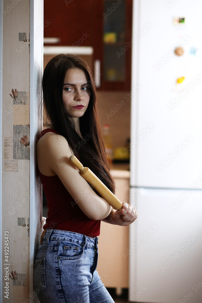 Pretty girl posing at camera in retro apartment. Emotion.Life style. Kitchen. Relationship. Pretty girl posing at camera in retro apartment. Emotion.Life style. Kitchen. Relationship.