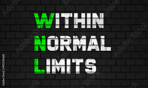 Within normal limits(WNL) concept,healthcare abbreviations on black wall photo