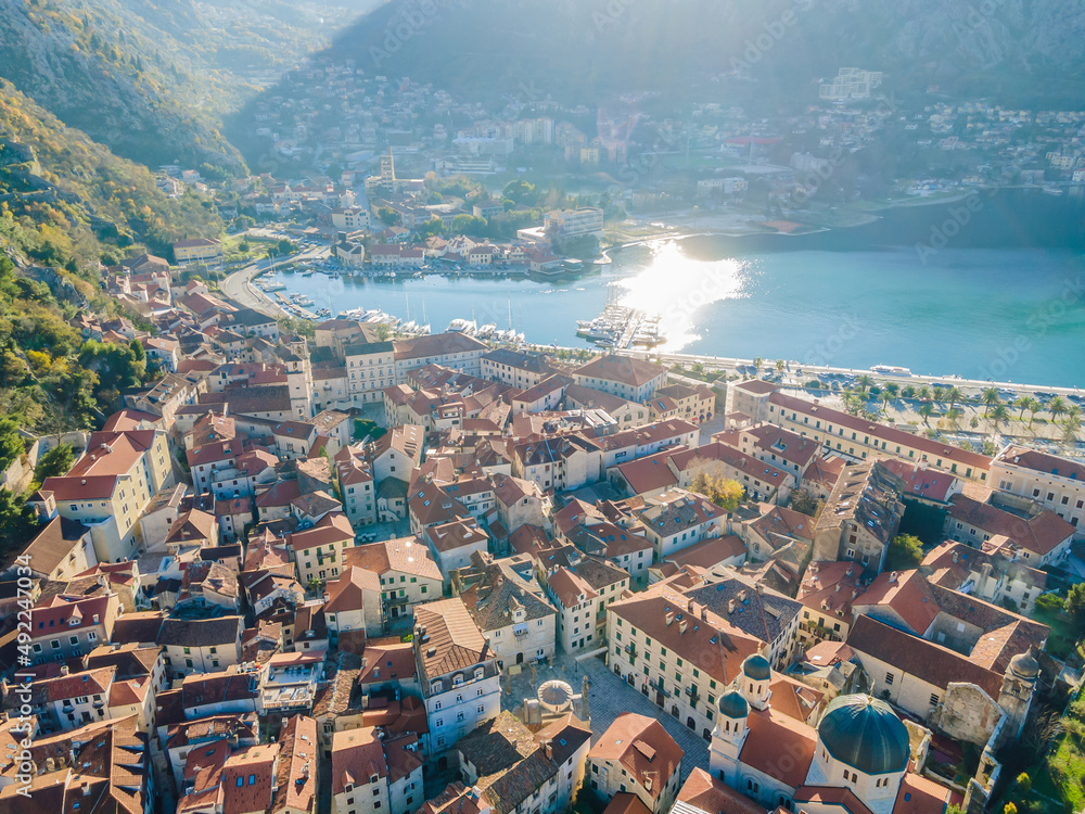 Old city. Kotor. Montenegro. Narrow streets and old houses of Kotor at sunset. View of Kotor from the city wall. View from above