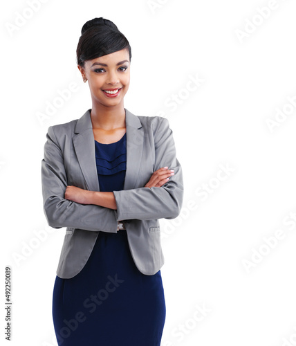 Confidence breeds success. Cropped portrait of a young businesswoman standing with her arms folded against a white background.