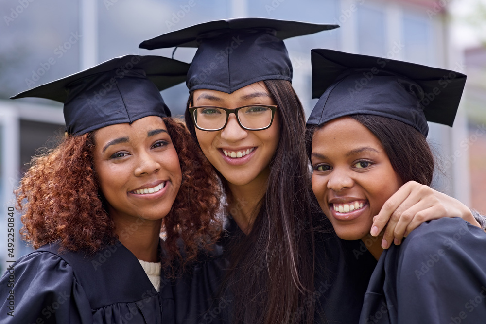 We did it together. Cropped shot of three young woman on their graduation day. We did it together. Cropped shot of three young woman on their graduation day.