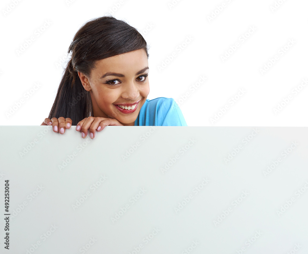 I stand behind your product. Studio shot of a young woman behind a blank white wall with copyspace. I stand behind your product. Studio shot of a young woman behind a blank white wall with copyspace.