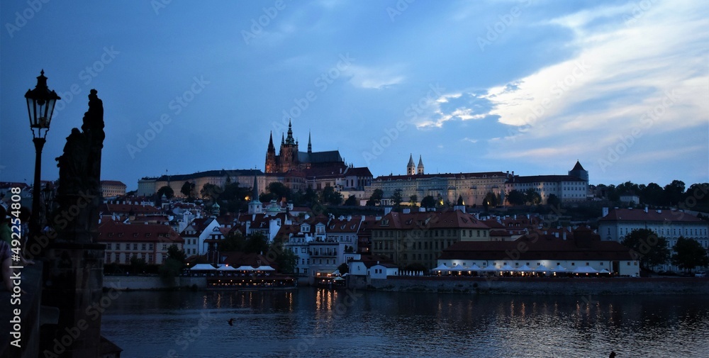 Prague castle view from city charles bridge in the evening
