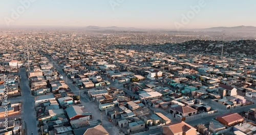 Poverty.Inequality.Aerial close-up fly over view of the densely populated Khayelitsha township on the Cape Flats, Cape Town, South Africa photo