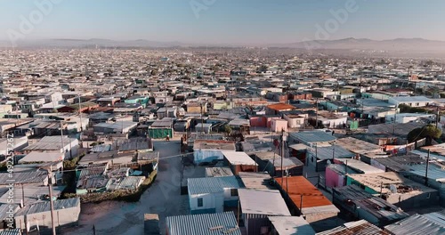 Poverty.Inequality.Aerial close-up fly over view of the densely populated Khayelitsha township on the Cape Flats, Cape Town, South Africa photo