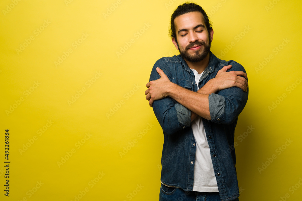 Attractive man embracing Attractive man embracing