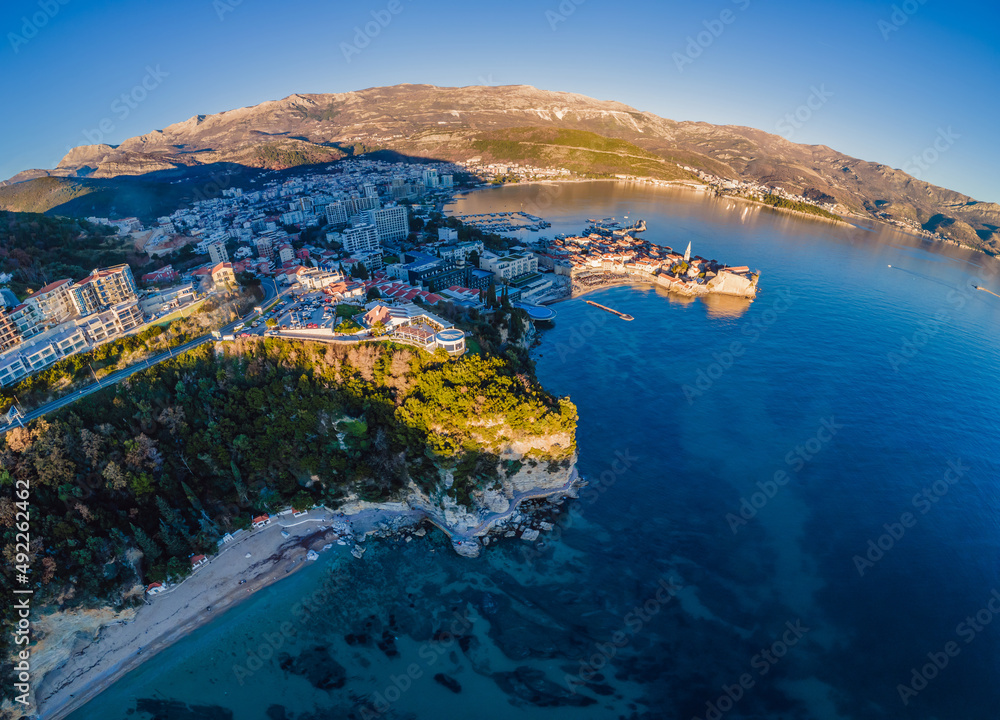 Fototapeta premium Landscape of Old town Budva: Ancient walls and red tiled roof. Montenegro, Europe. Budva - one of the best preserved medieval cities in the Mediterranean and most popular resorts of Adriatic Riviera