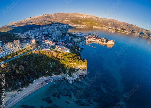 Fototapeta Naklejka Na Ścianę i Meble -  Landscape of Old town Budva: Ancient walls and red tiled roof. Montenegro, Europe. Budva - one of the best preserved medieval cities in the Mediterranean and most popular resorts of Adriatic Riviera