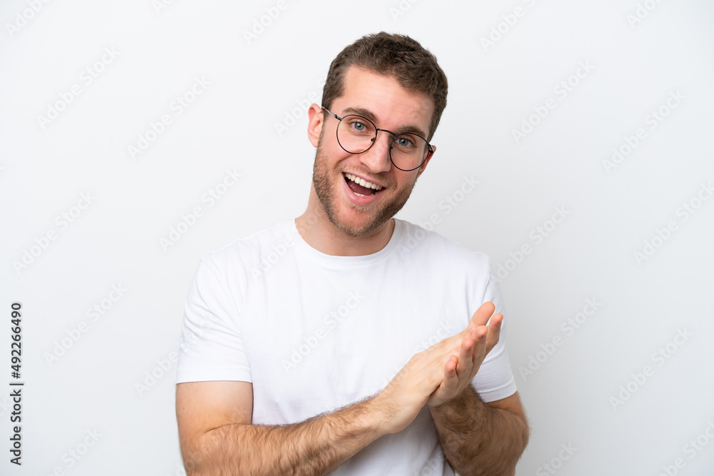 Young caucasian man isolated on white background With glasses and applauding Young caucasian man isolated on white background With glasses and applauding