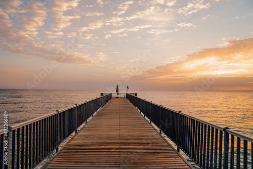 Beautiful sunrise over the ocean with a footbridge in Makadi Bay  Egypt