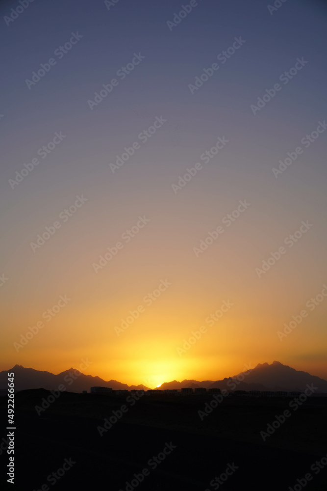 A small village in a rocky desert at sunset in Hurgharda, Egypt