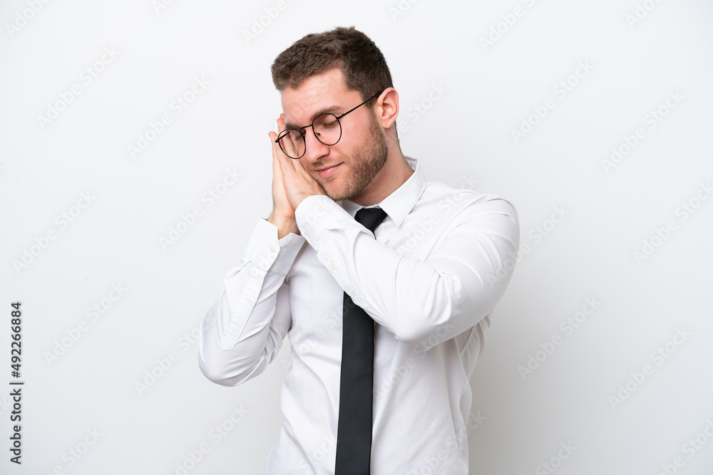 Young business caucasian man isolated on white background making sleep gesture in dorable expression Young business caucasian man isolated on white background making sleep gesture in dorable expression