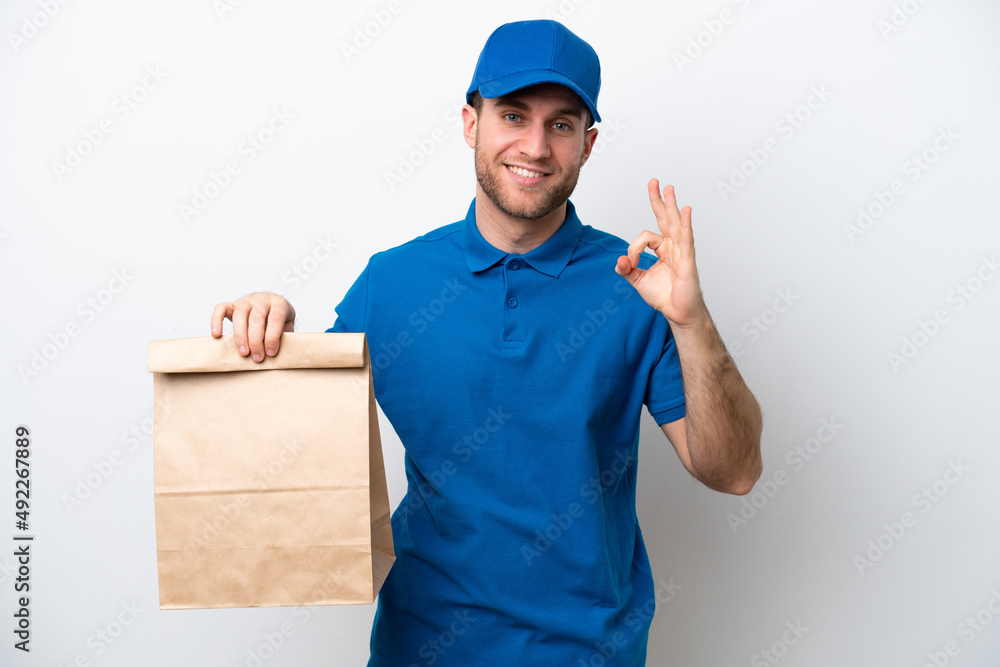 Delivery caucasian man isolated on white background showing ok sign with fingers Delivery caucasian man isolated on white background showing ok sign with fingers